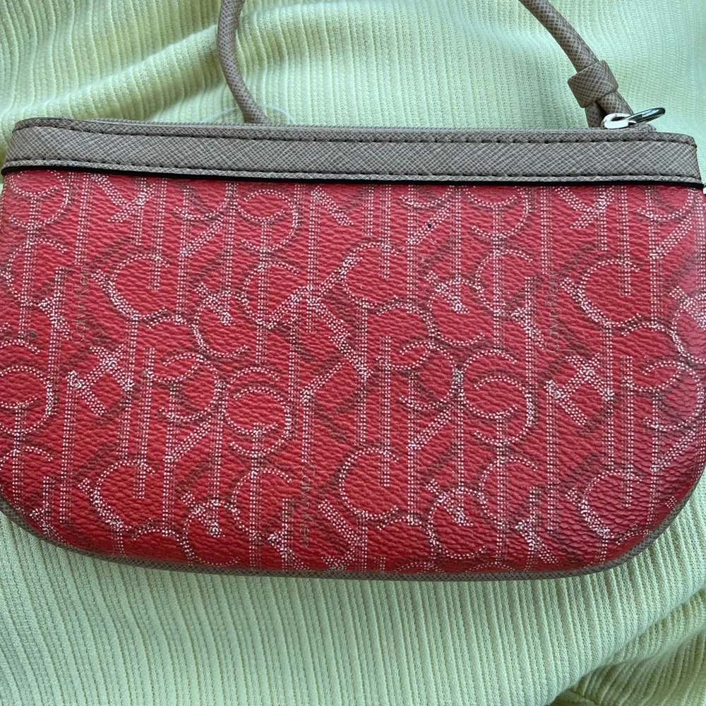 Calvin Klein Wristlet Women’s zipper coin purse 5x7‎ Orange W/Tan Trim w/CK logo